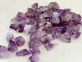 Small raw amethyst points tumble