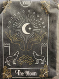 Black tarot card pouch featuring The Moon card design with white and gold line art
