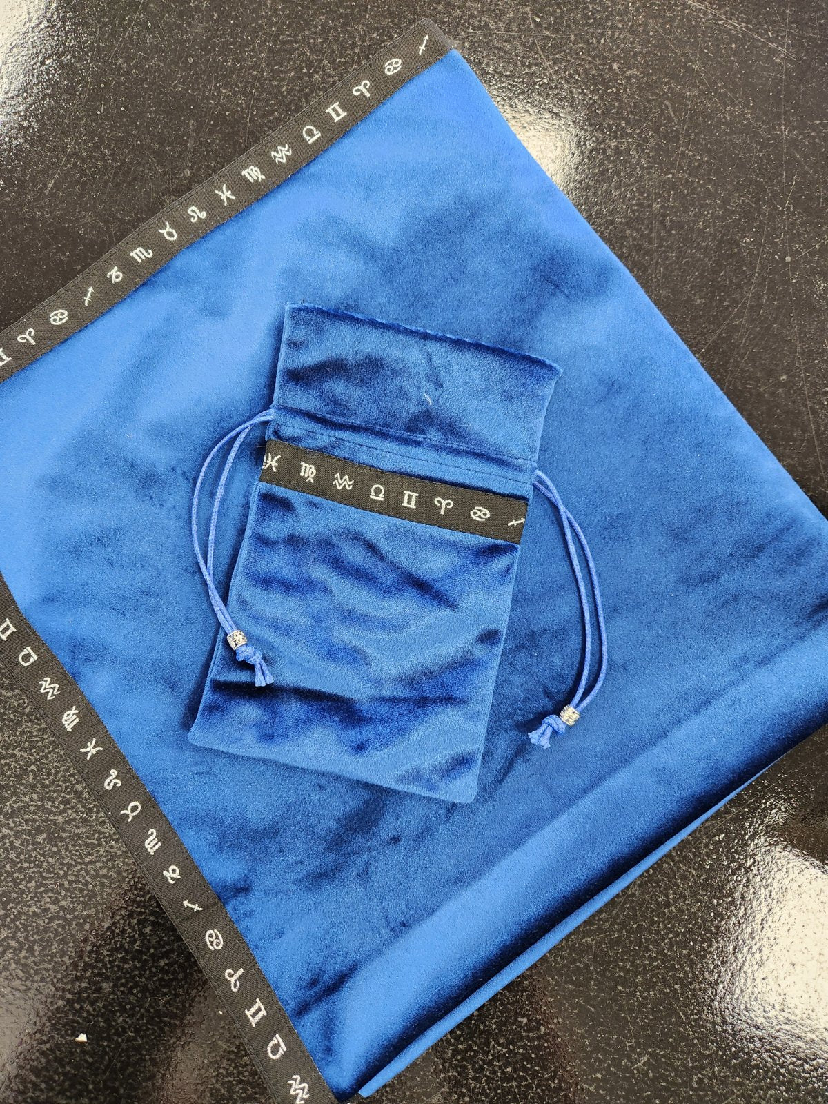 Blue velvet tarot cloth and drawstring bag with zodiac symbols on black trim