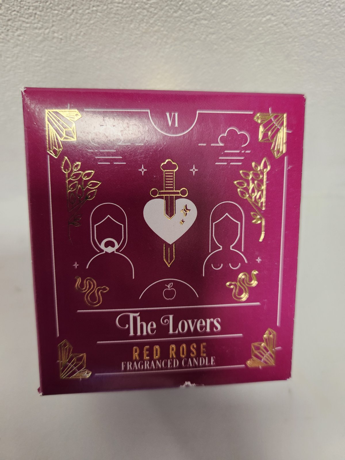 The Lovers Red Rose Fragranced Candle in magenta box with gold tarot imagery and heart sword design