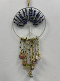 Sodalite Crystal Tree of Life suncatcher with dark blue beads, wire branches, and hanging gemstone pendants