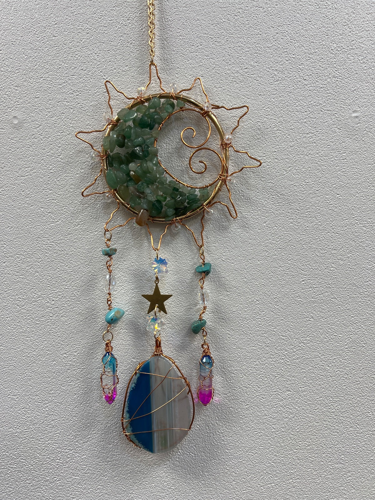 Copper wire sun dreamcatcher with green aventurine stone, agate slice, and hanging crystal charms