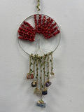 Red coral crystal tree of life suncatcher with wire frame, hanging stones, and green leaf accents
