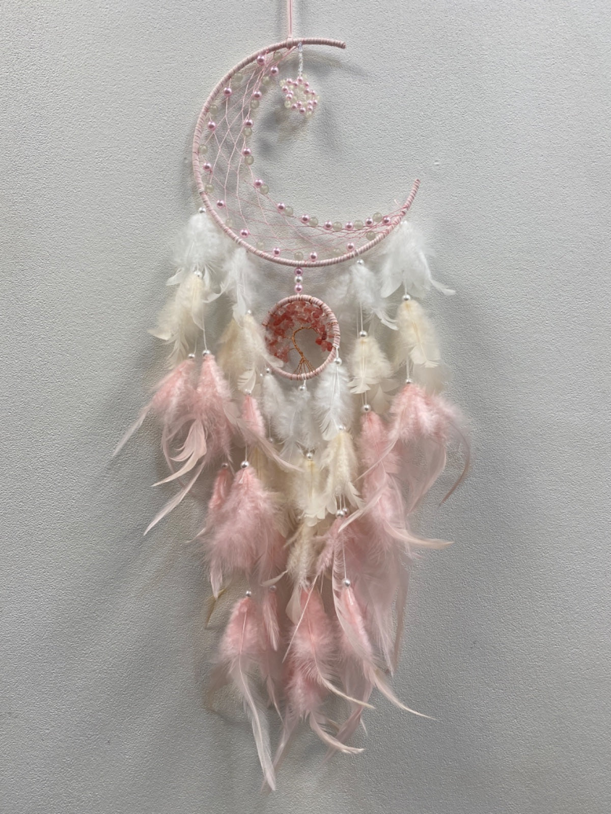 Pink and white beaded moon dreamcatcher with tree of life pendant and feathers