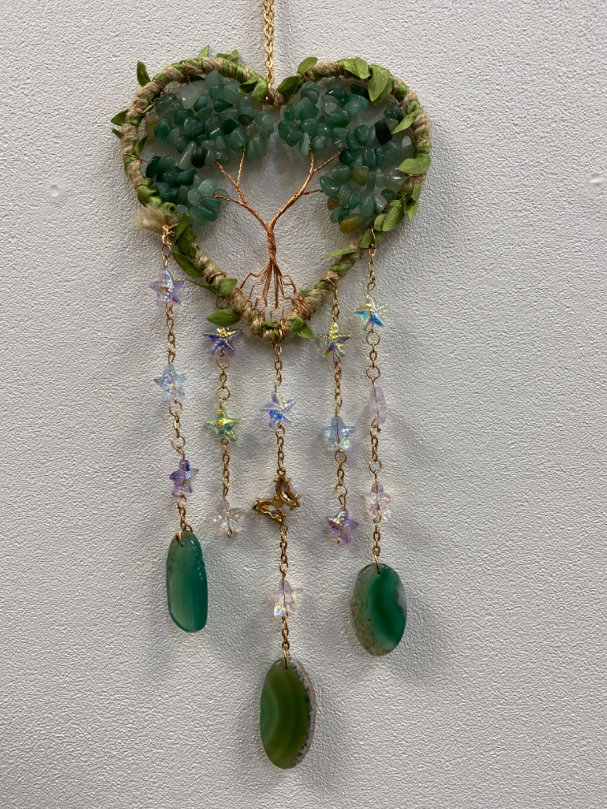 Heart-shaped aventurine chip suncatcher with copper wire tree, dangling green stone pendants and beaded chains