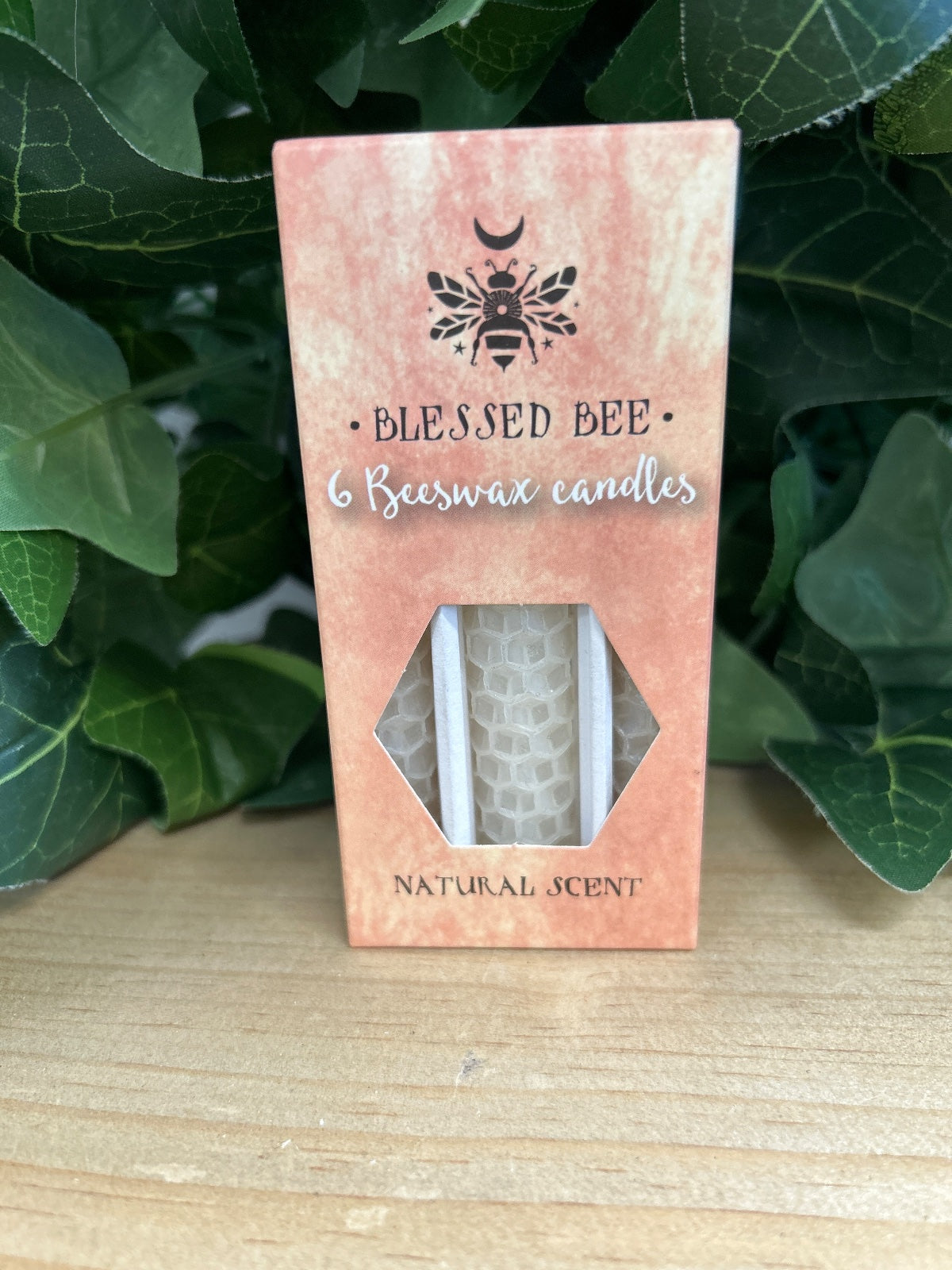 Pack of 6 white beeswax candles in a pink cardboard box with bee logo and 'Blessed Bee' branding