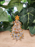 Glass Christmas tree ornament, 6.5cm tall, with clear body and amber star top and hanging beads