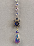 Decorative turtle window hanger with purple faceted crystal beads and iridescent teardrop charm
