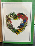 Heart-shaped greeting card with NZ native bird and flowers including red bottlebrush, white blossoms, yellow flowers, and a blue tui bird