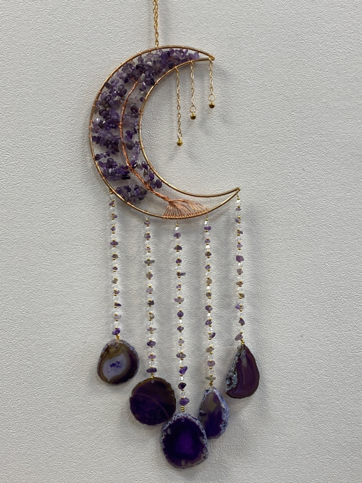 Brass crescent moon hanger filled with amethyst chips, hung with five beaded strands of amethyst and clear quartz ending in agate slice pendants.