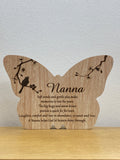 Wooden butterfly-shaped plaque engraved with 'Nanna' and a poem, with bird and branch design
