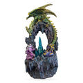 Green and gold dragon figurine perched above dark stone archway with purple crystals and glowing teal crystal center