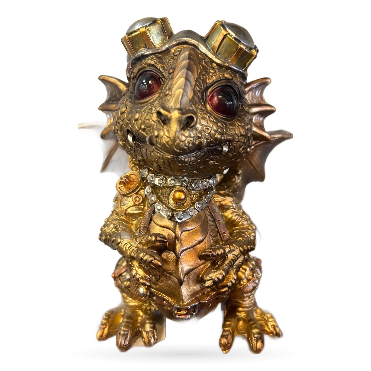Brass steampunk dragon figurine with ruby eyes, ornate detailing, and mechanical elements