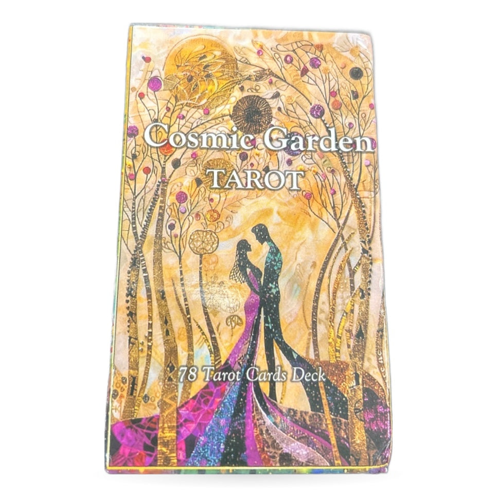 Cosmic Garden Tarot deck box featuring golden artwork with two figures and celestial botanical design