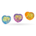 Three heart-shaped squishy fidget toys in blue, purple, and orange with yellow glitter