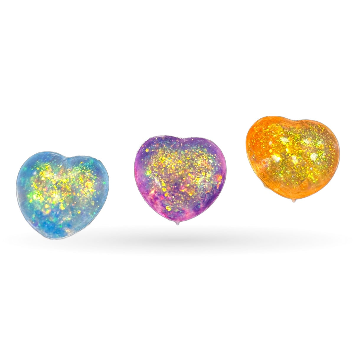 Three heart-shaped squishy fidget toys in blue, purple, and orange with yellow glitter