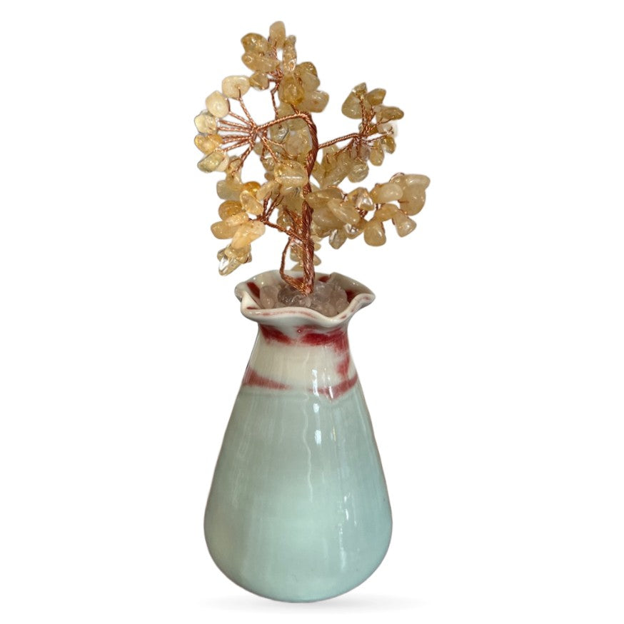 Citrine crystal money tree with golden tumbled stone branches in pale green ceramic vase with red accents