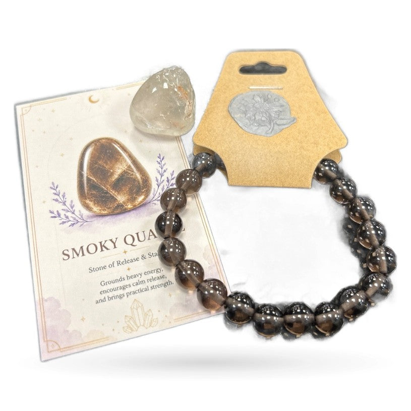 Smoky quartz tumble stone, beaded bracelet, and informational card displayed together