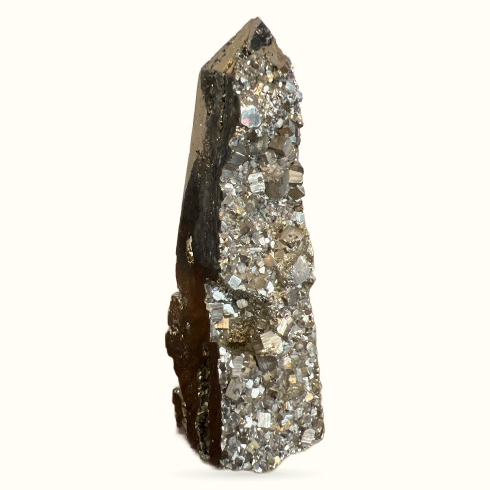 Tall pyrite tower specimen with metallic cubic crystals and dark matrix, pointed apex