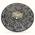 Black circular pagan board with zodiac symbols, moon phases, and eagle emblem in center