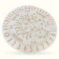 Large circular wooden sun and moon divination board with engraved celestial design and numbered ring