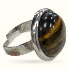 Adjustable silver-toned ring with oval tiger's eye stone showing golden and black striping