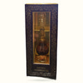 Patchouli fragrant oil in ornate dark blue box with gold decorative patterns and glass display window