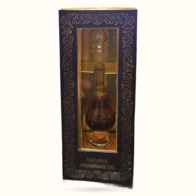 Patchouli fragrant oil in ornate dark blue box with gold decorative patterns and glass display window