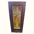 Purple ornate box containing a glass bottle of golden fragrant oil with decorative stopper