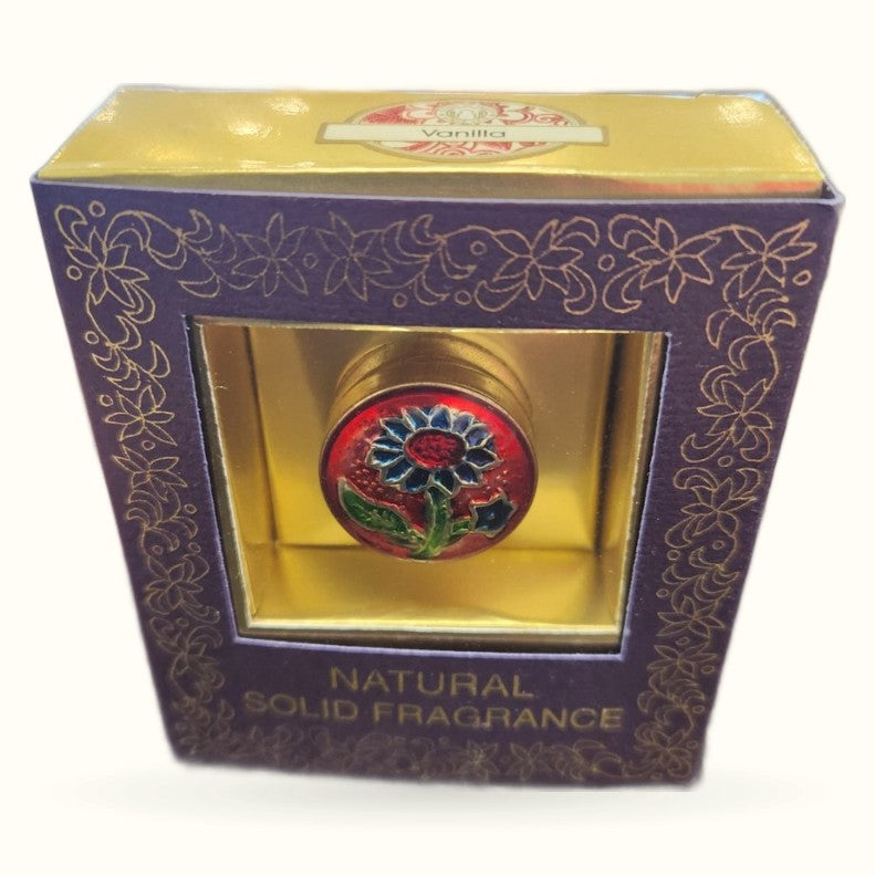 Purple decorative box with ornate gold floral patterns displaying Song of India vanilla solid fragrance with red flower emblem