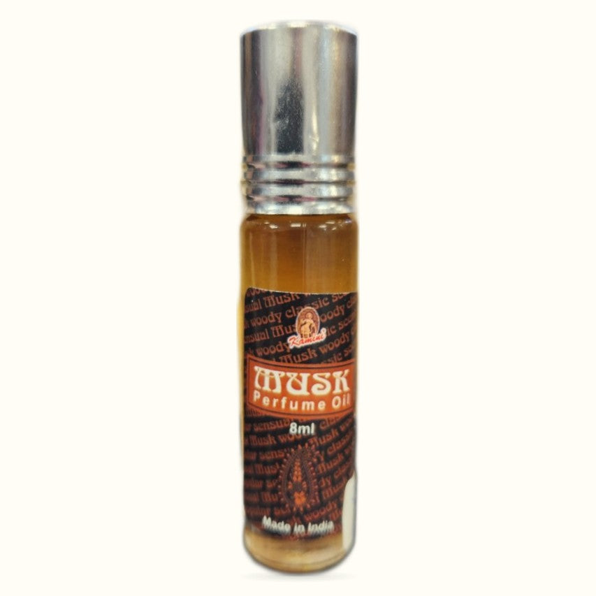 Kamini Musk Perfume Oil in 8ml amber glass bottle with silver metallic cap and brown label