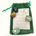Green velvet pouch with five polished crystals and an information card describing their metaphysical properties