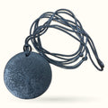 Shungite Tree of Life disc necklace with textured circular pendant on black braided cord