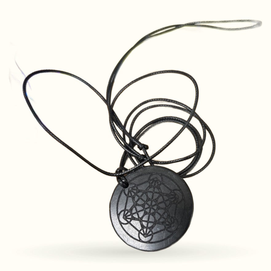 Black shungite disc pendant with sacred geometry pattern on black cord necklace