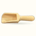 Natural wooden scoop with rounded handle and wide flat bowl, light cream finish