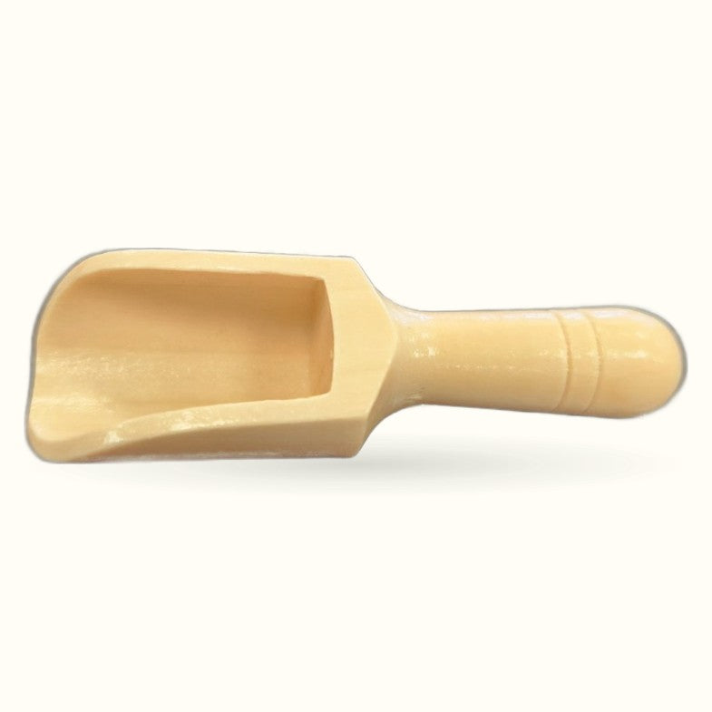 Natural wooden scoop with rounded handle and wide flat bowl, light cream finish