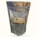 300g bag of Lotus lavender bath salts by Simplyb, showing pale crystalline salt granules in clear pouch