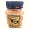 Meditation bath salt in clear glass jar with black screw cap, peachy-pink crystals visible inside