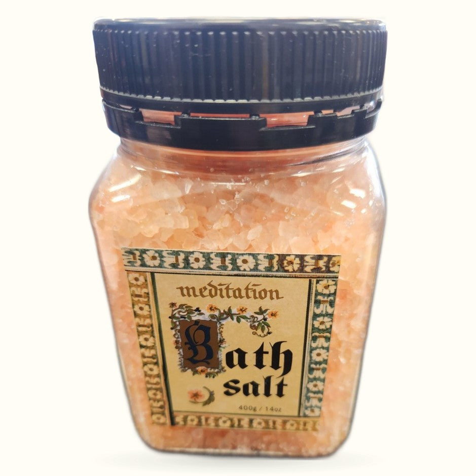 Meditation bath salt in clear glass jar with black screw cap, peachy-pink crystals visible inside