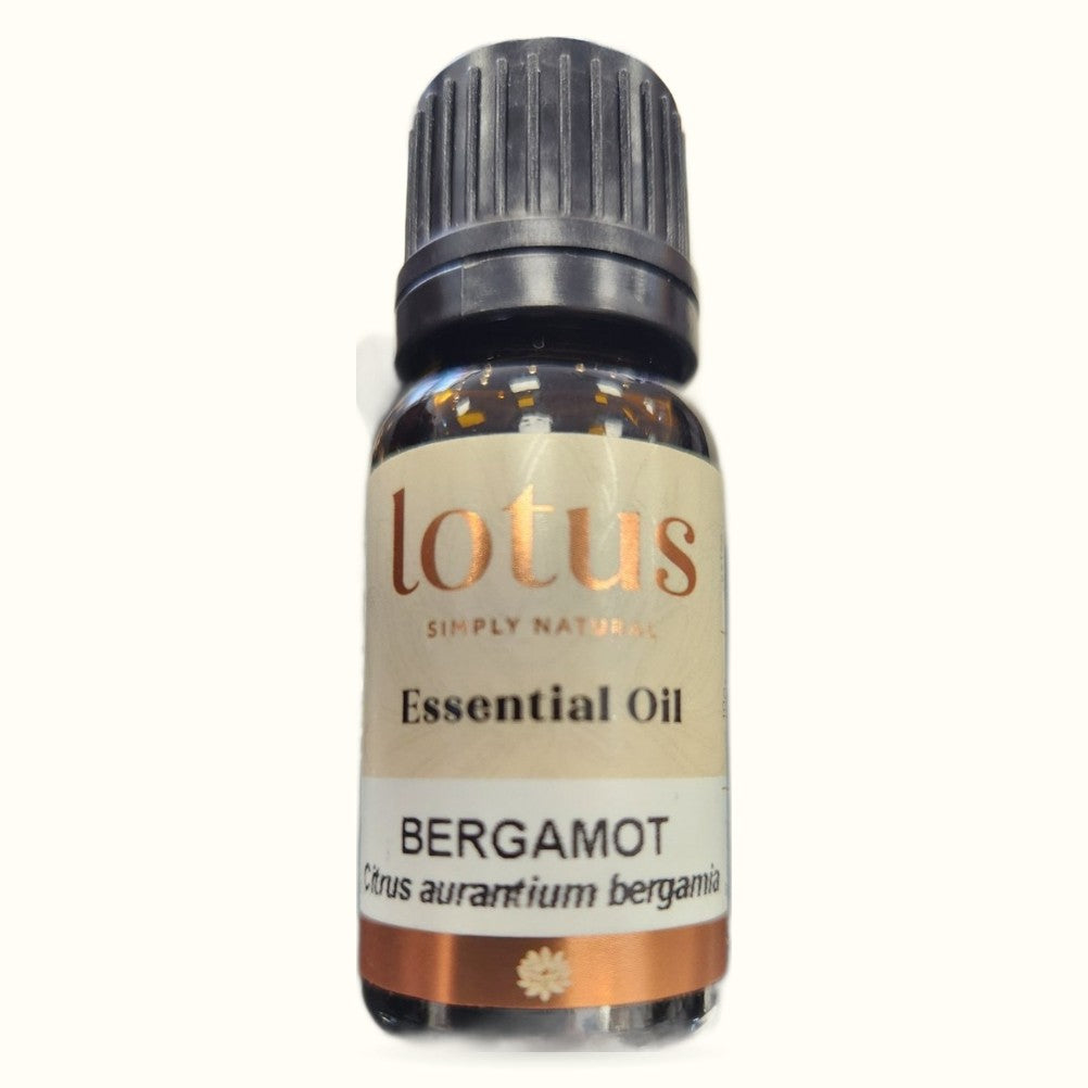 Lotus Bergamot essential oil bottle with amber glass, black cap, and cream label with orange band