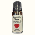 Kamini Romantic Rose fragrance oil bottle, 10ml, amber glass with black cap and cream label featuring red rose heart design
