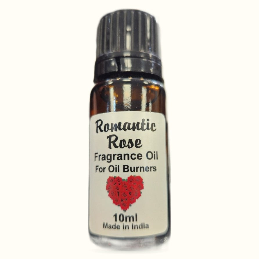 Kamini Romantic Rose fragrance oil bottle, 10ml, amber glass with black cap and cream label featuring red rose heart design