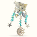 Silver butterfly hanger with turquoise beads, crystal drops, stars, and sun-moon charm pendant