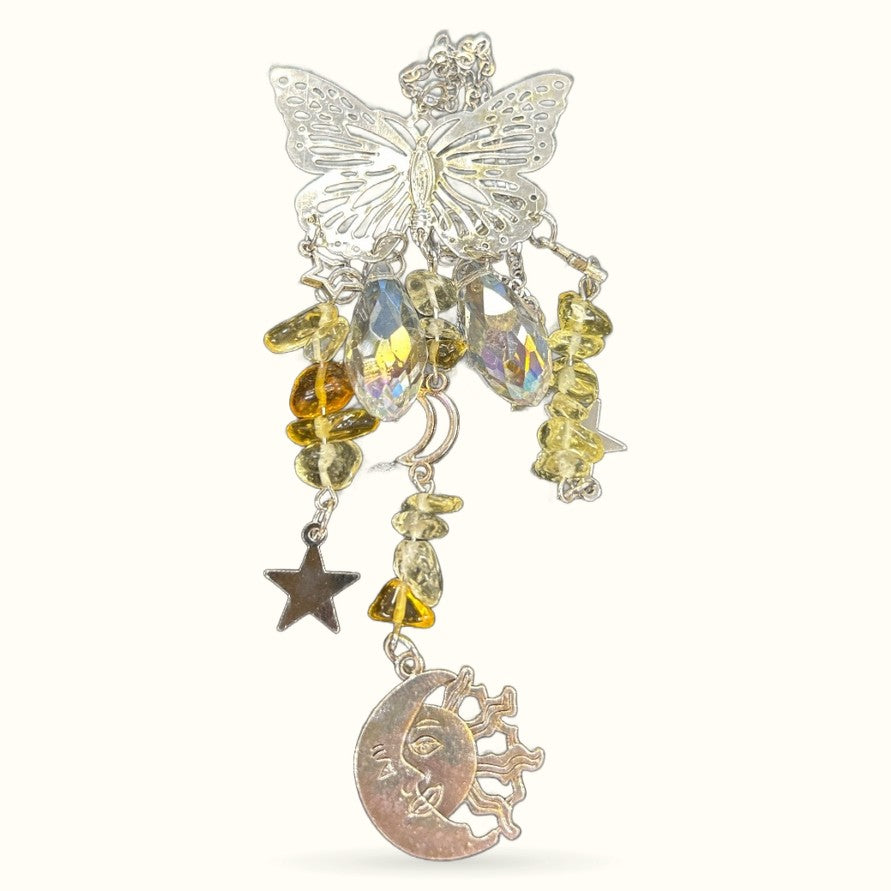Silver filigree butterfly hanger with citrine crystals, star charm, and crescent moon pendant