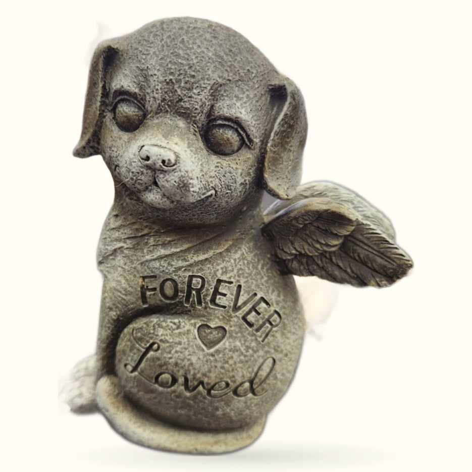 Stone dog memorial figurine with angel wings and 'Forever Loved' text engraved on body