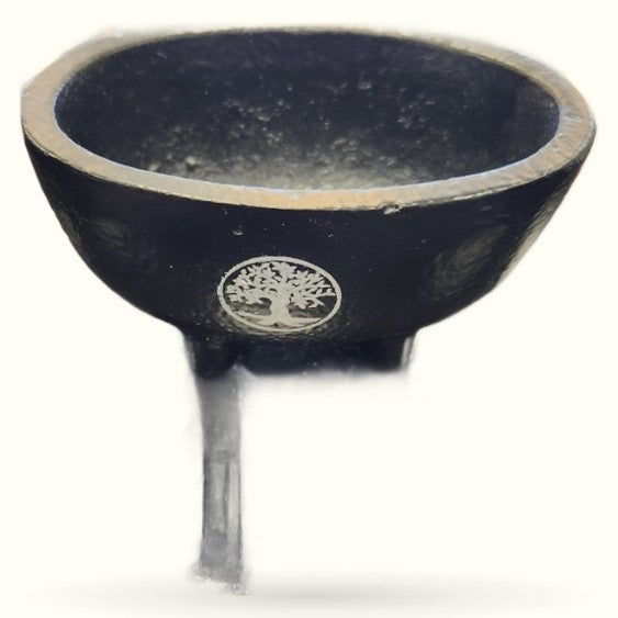 Black cauldron with tree of life emblem and single leg stand