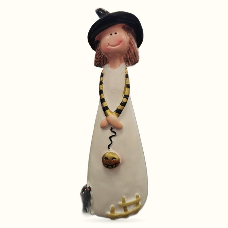 Resin witch figurine with brown hair, black hat, cream robe, yellow and black snake necklace holding gold pumpkin