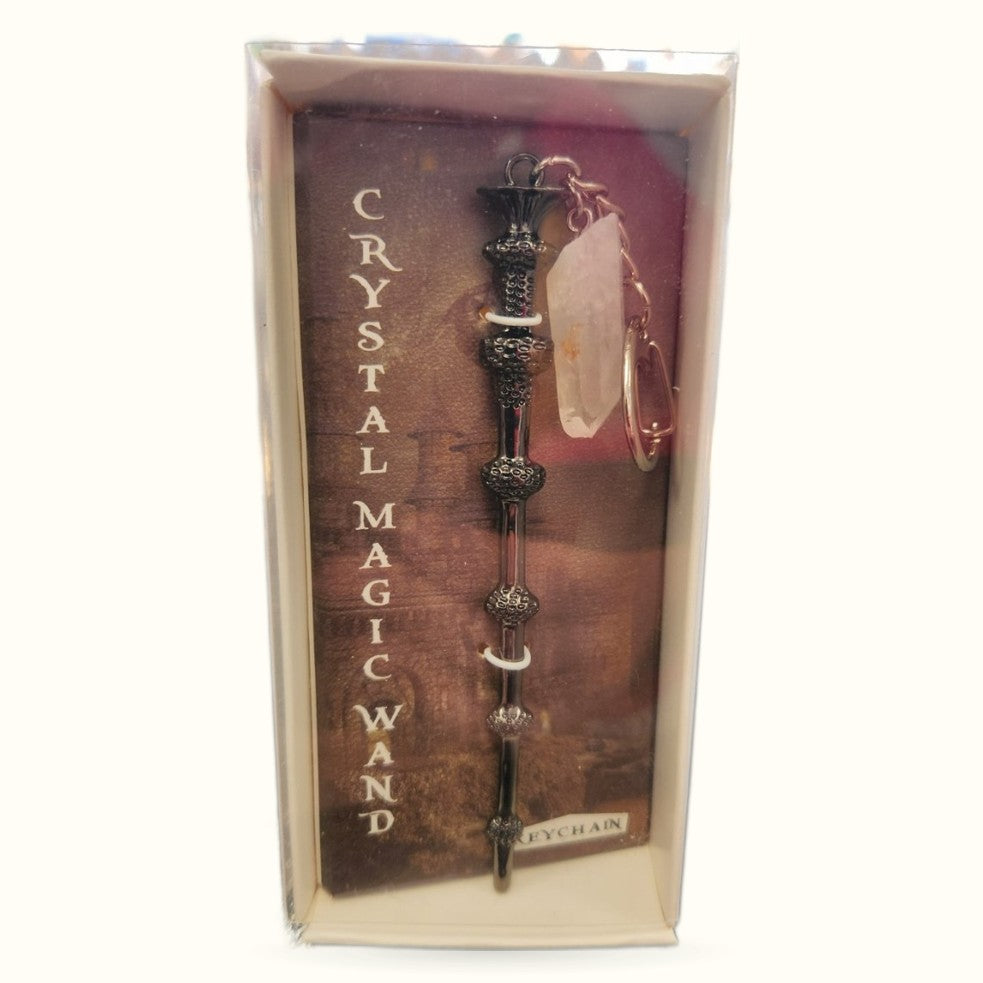 Crystal Magic Wand keychain with ornate black metal handle and clear quartz stone, displayed in branded packaging