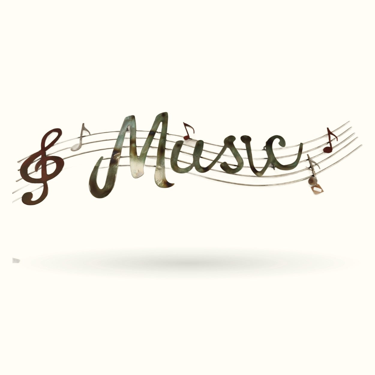 Metal wall hanger with musical staff design and cursive 'music' text in green and brown tones