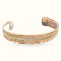 Gold and copper magnetic cuff bracelet with detailed chevron pattern design